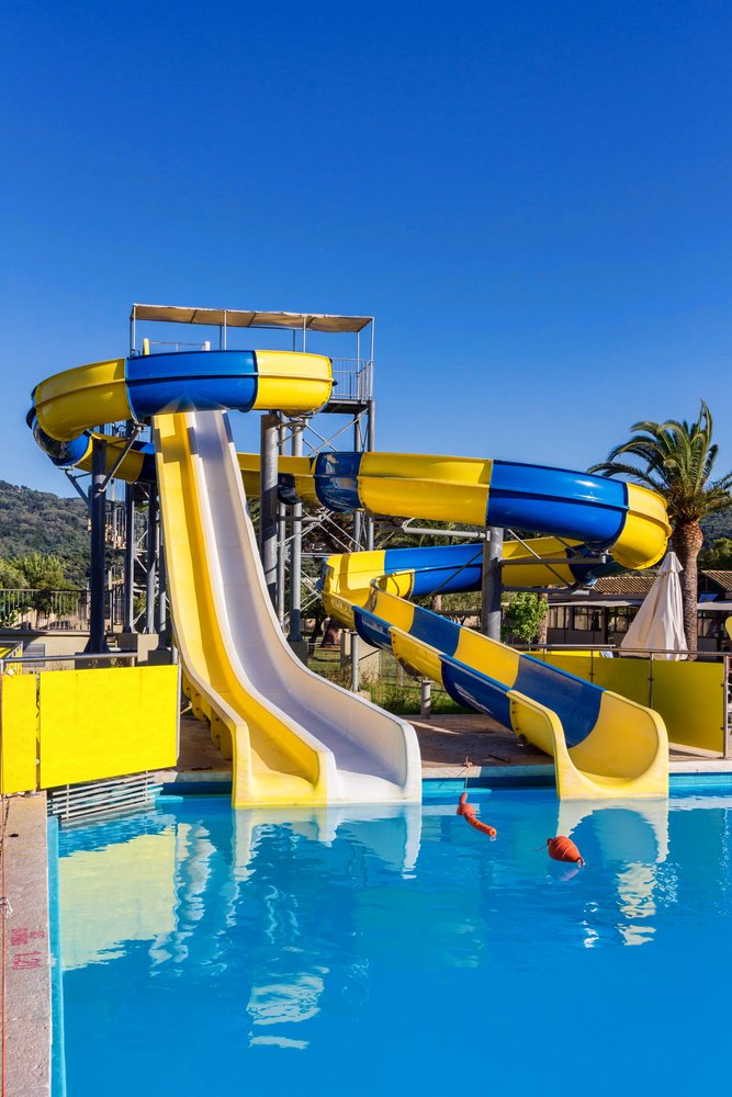 Yellow and blue fiberglass water slides